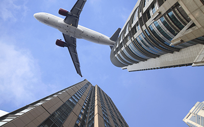 Plane over city