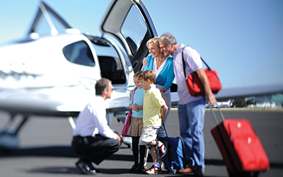 A family getting on an airplane to travel