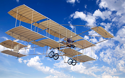 Old yellow airplane with double wings