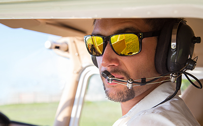 A male pilot flying a plane