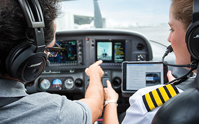 Two pilots talking while in a plane