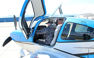 Student and pilot in plane