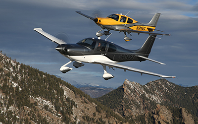 A plane flying in the mountains