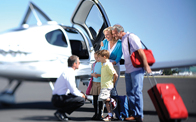 Family boarding a small private plane